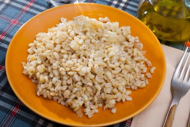 Pearl porridge with cheese in a slow cooker