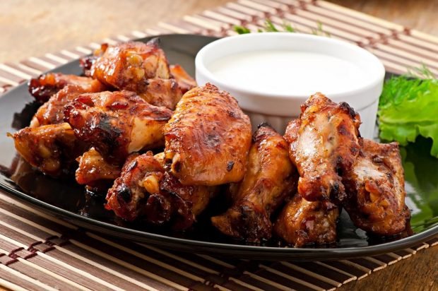 Chicken wings baked in adjika