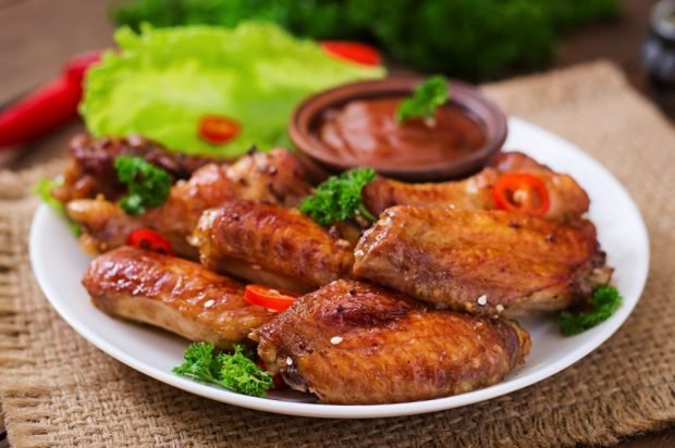 Chicken wings baked with ketchup, sour cream and mustard 