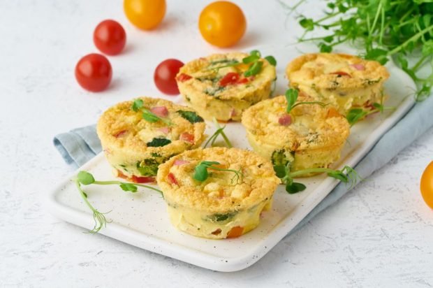 Omelet baked with bacon and vegetables in serving molds 