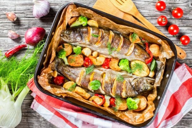 Baked trout with vegetables in foil in the oven 