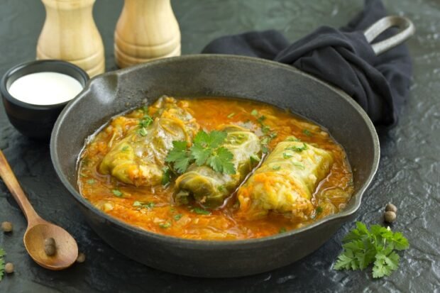 Stuffed cabbage rolls with minced meat in a frying pan