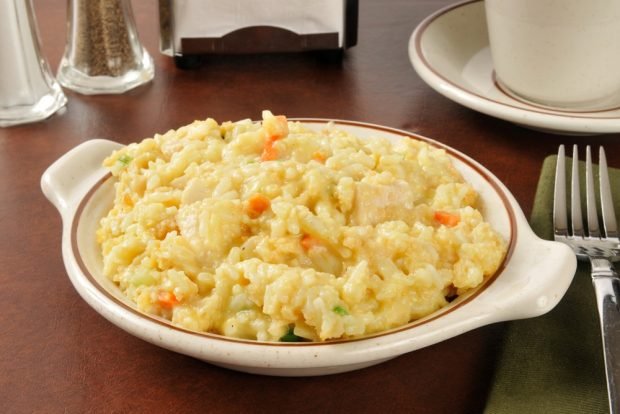 Rice casserole with chicken and cream in a slow cooker 