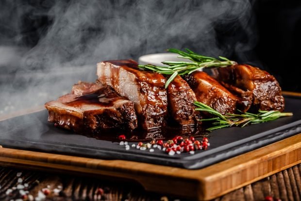 Pork ribs with garlic in the oven in foil