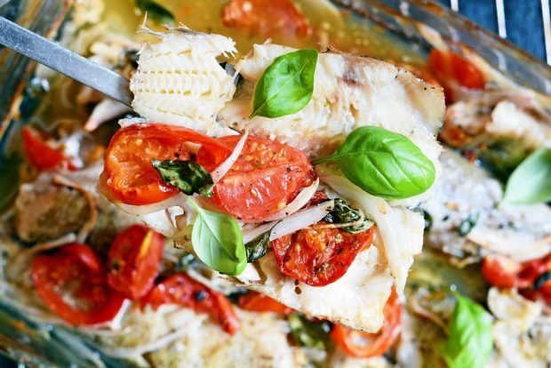 Pollock with tomatoes and basil in the oven