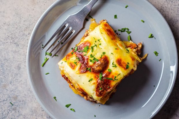 Potato casserole with minced meat and cheese in the oven 