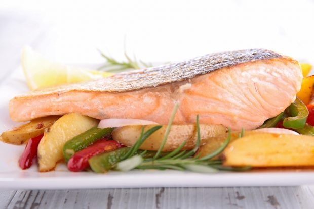 Salmon with potatoes and vegetables in the oven 