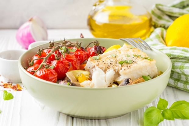 Hake with vegetables and mushrooms in the oven