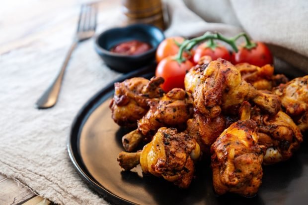 Barbecue chicken legs in a frying pan