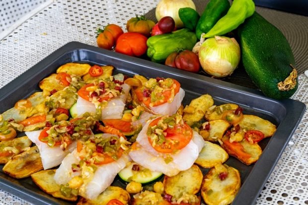 Hake with potatoes and tomatoes is a simple and delicious recipe how to cook step by step