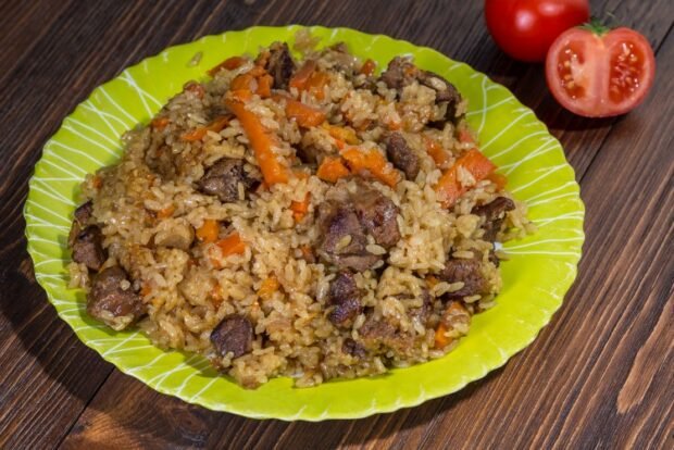 Pilaf with beef in a frying pan 