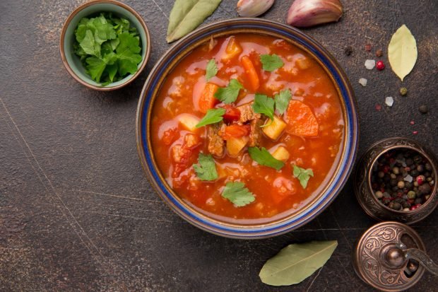 Pork kharcho soup with potatoes and rice at home