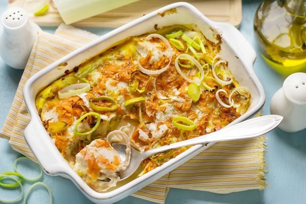 Baked hake with potatoes and carrots