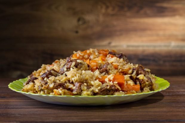 Pilaf on the grill in a cauldron 