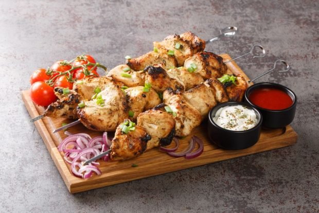 Chicken shish kebab with mayonnaise on the grill 