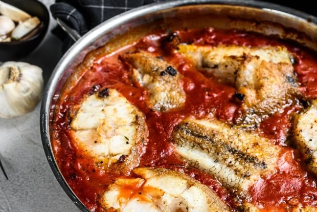 Hake in tomato in the oven is a simple and delicious recipe how to cook step by step