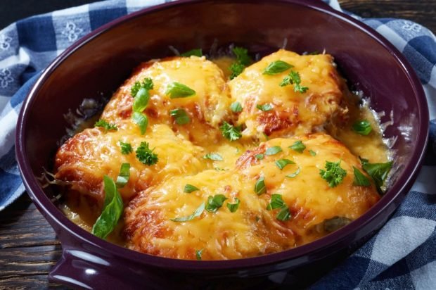 Pork chops with tomatoes and cheese in the oven