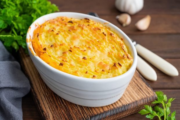 Cottage cheese casserole with carrots under cheese