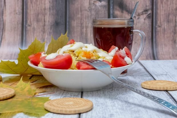 Rice porridge with vegetables in a frying pan is a simple and delicious recipe for cooking step by step