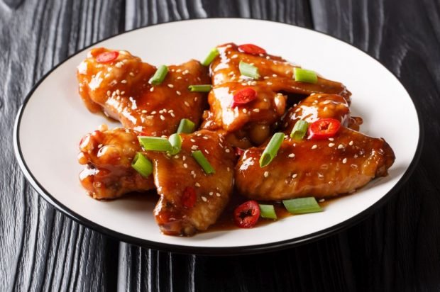 Chicken wings baked in sweet and sour sauce 