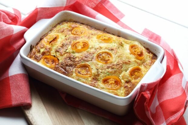 Vegetable casserole with cheese and yellow tomatoes