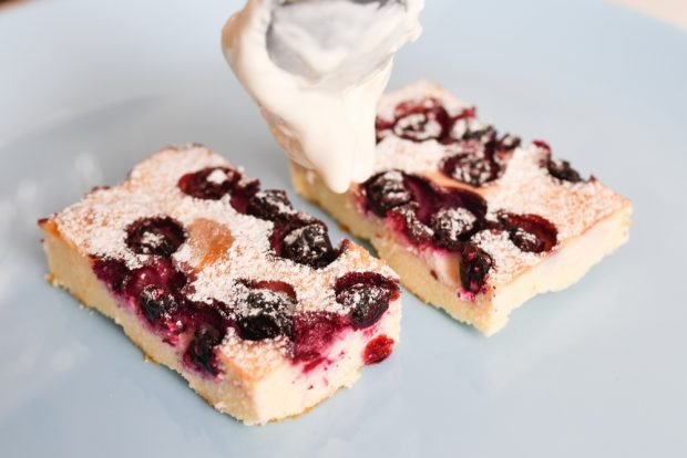 Cottage cheese casserole with berries in a frying pan