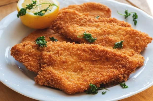 Turkey chops baked in breadcrumbs from corn flakes