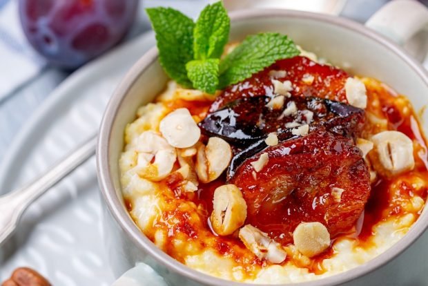 Millet porridge with plum in pots 