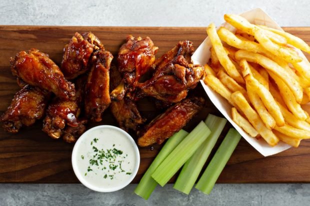 Chicken wings with ketchup and pomegranate sauce in the oven