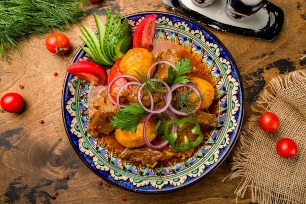 Pork kebab with potatoes in a cauldron