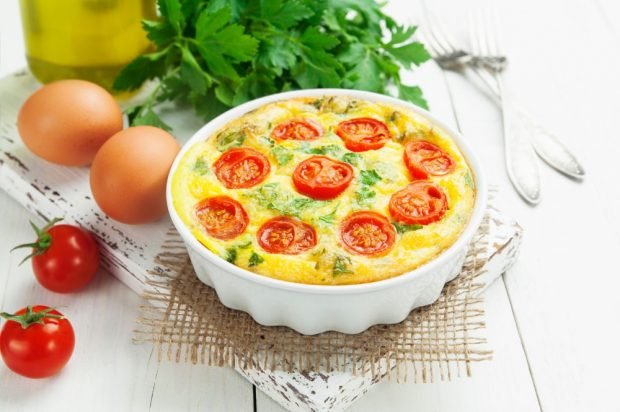 Omelet with cherry tomatoes and cheese in the oven