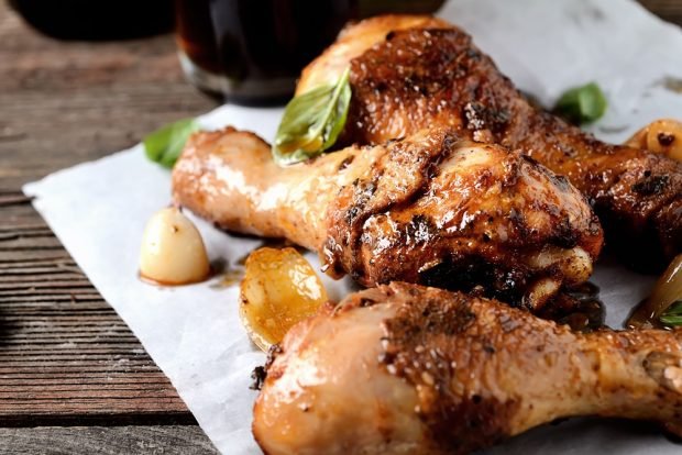 Chicken legs in beer in a frying pan