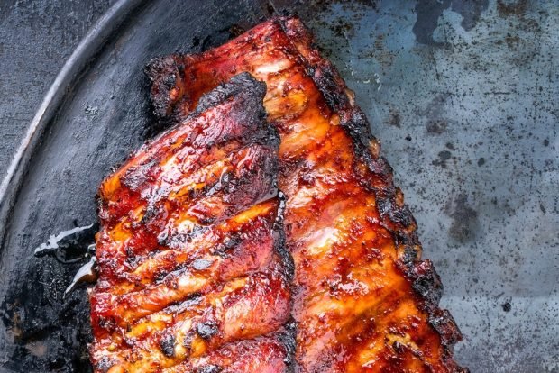 Pork ribs on the grill in foil