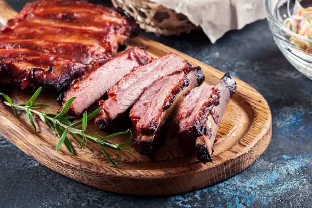 Baked pork ribs in the oven in the sleeve