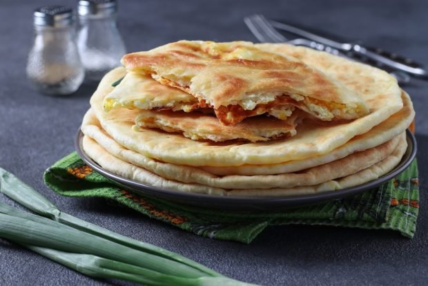 Khachapuri with cottage cheese in a frying pan 