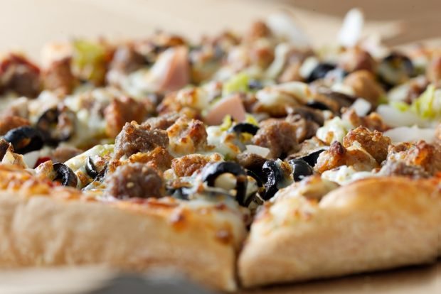 Pizza with minced meat and olives 