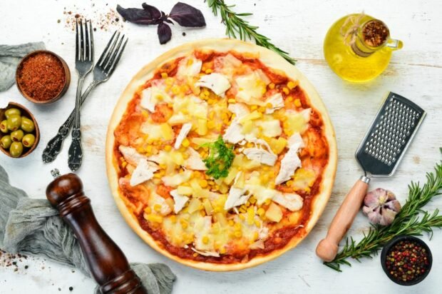 Classic pizza with chicken and pineapples 