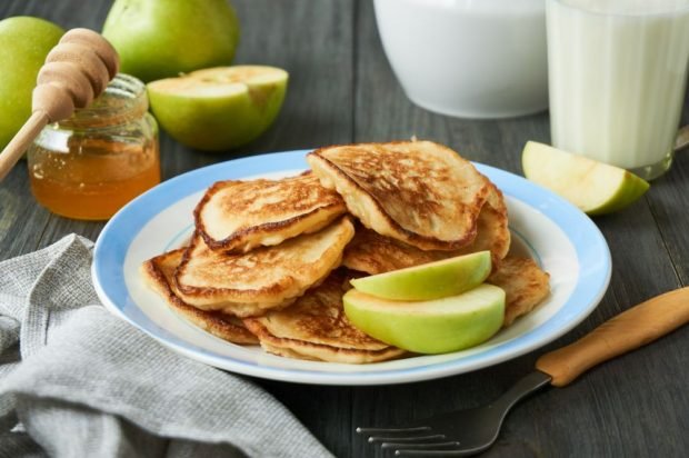 Pancakes with apples on milk