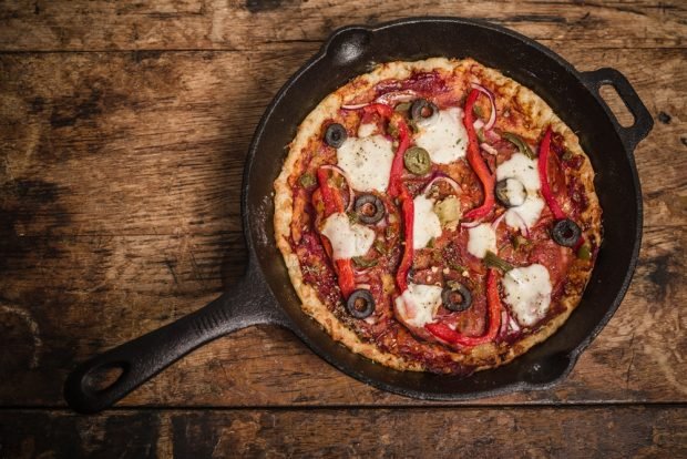 Pizza with tomatoes and mozzarella on milk