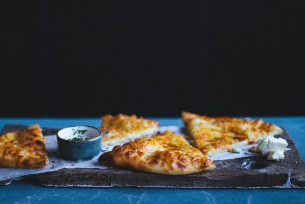 Khachapuri with feta in a frying pan 