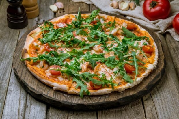 Pizza with shrimp, cherry tomatoes and arugula is a simple and delicious recipe, how to cook step by step