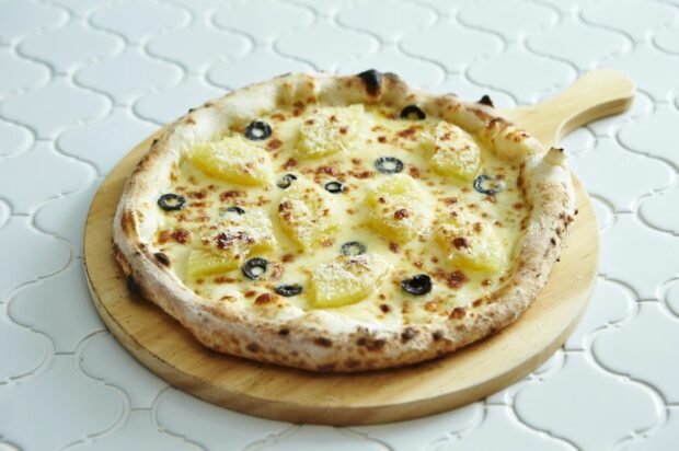 Cheese pizza with pineapples and olives is a simple and delicious recipe, how to cook step by step