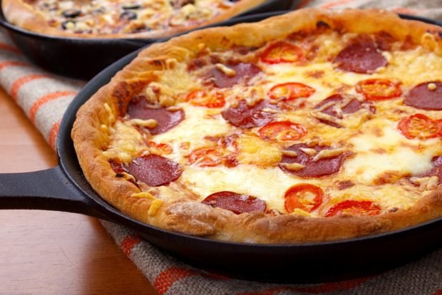 Pizza with smoked sausage on sour cream is a simple and delicious recipe how to cook step by step