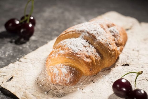 French croissants with cherries