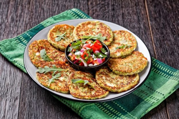 Pancakes made of zucchini and cheese on mayonnaise