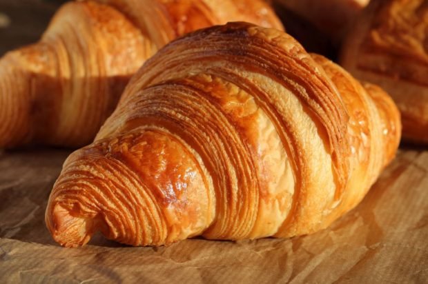 Croissants with honey from homemade puff pastry