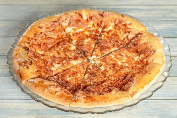 Khachapuri with Adyghe cheese in a frying pan 