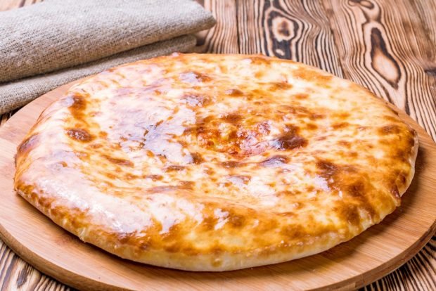 Khachapuri with vegetables in a frying pan 