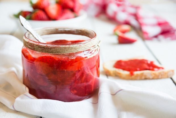 Strawberry jam with halves of berries