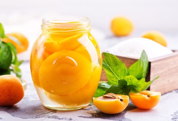 Apricots halves in syrup for the winter without sterilization